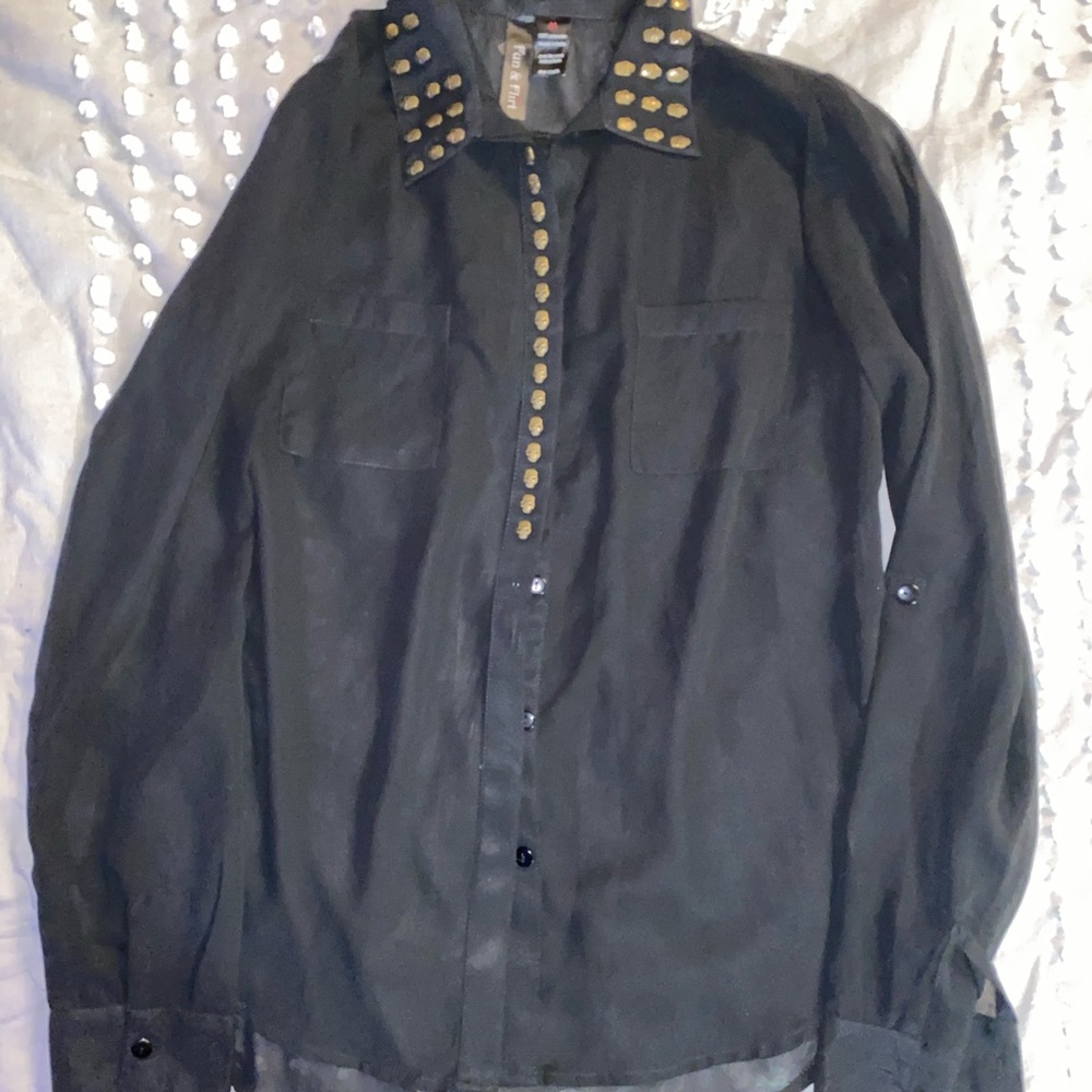 Sheer black top with metal skulls